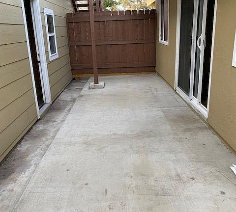 Back patio between the 3rd bedroom and the garage