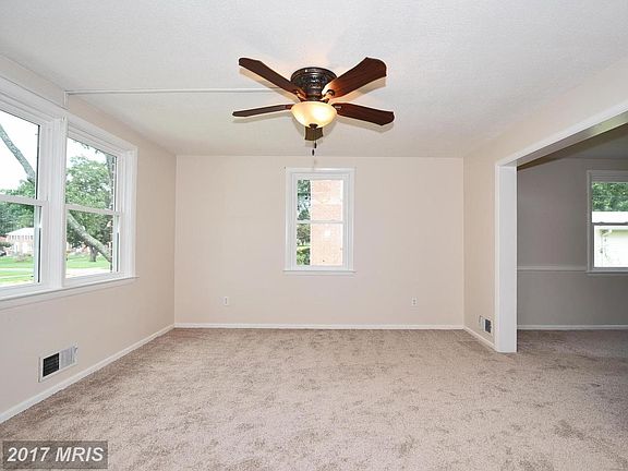 Living room w/ new carpeting (hardwood underneath)