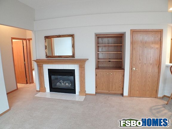 Main Living Area with Fireplace and Oak Built In Shelves