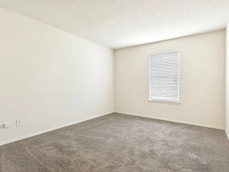 Inviting spaces with plush carpeting and window blinds for privacy and comfort, professionally operated by Highlands Vista Group.