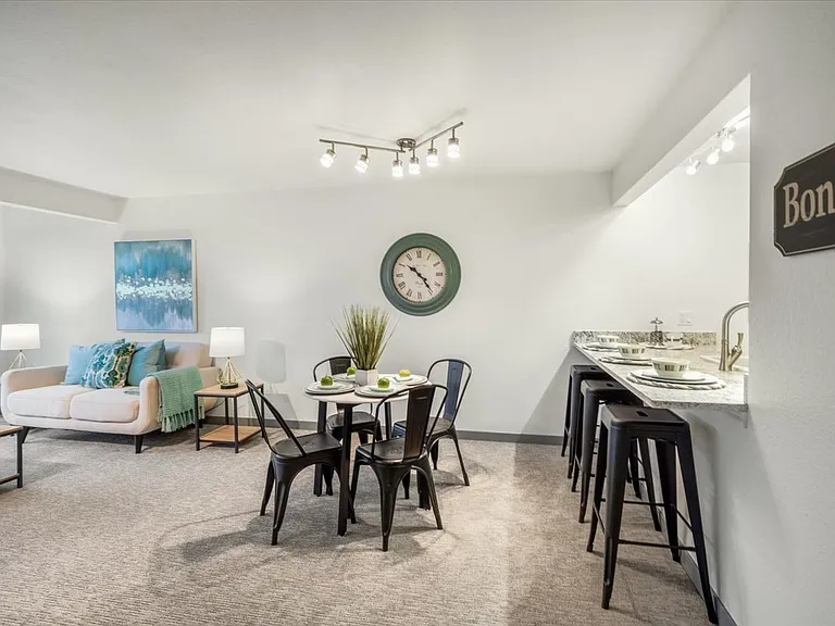 Eating nook and bar seating in kitchen.