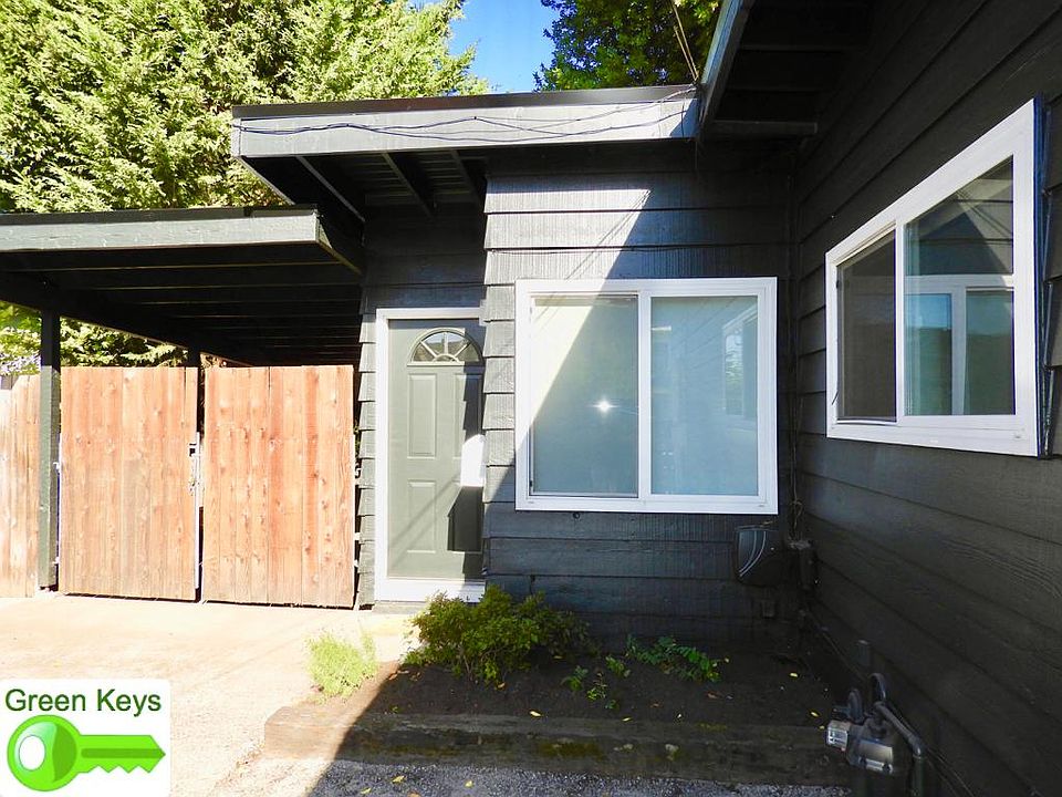 Front exterior with locked carport