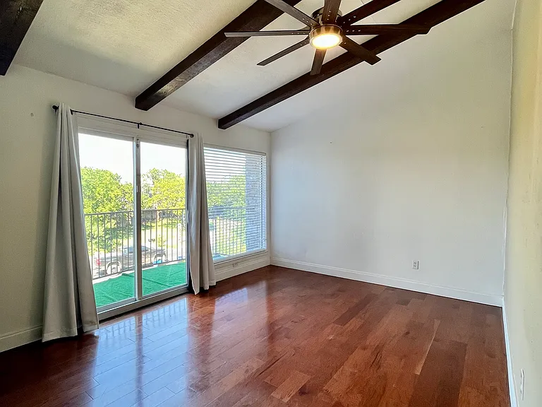 bedroom #2 with balcony, can see the downtown skyline and UT tower.