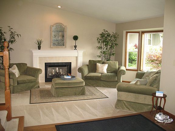 Lovely living room with lots of windows for natural light.