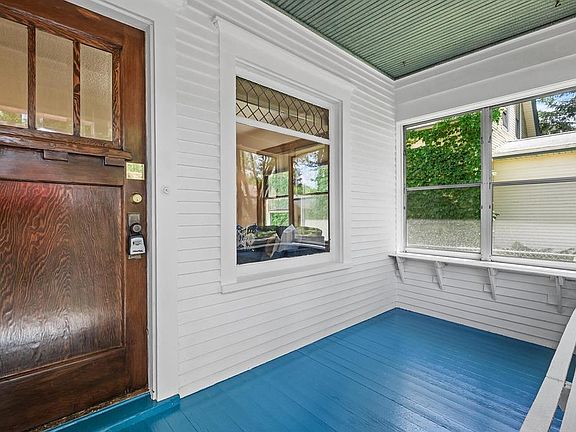 Sunny front porch adds extra flex space to enjoy.