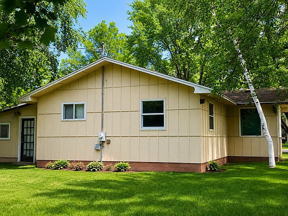 Spacious primary bedroom with large windows and plenty of room for a full bedroom furniture set in this Wausau home.