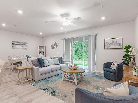 Downstairs, enjoy a spacious, open living area - Aspen townhome by Highland Homes