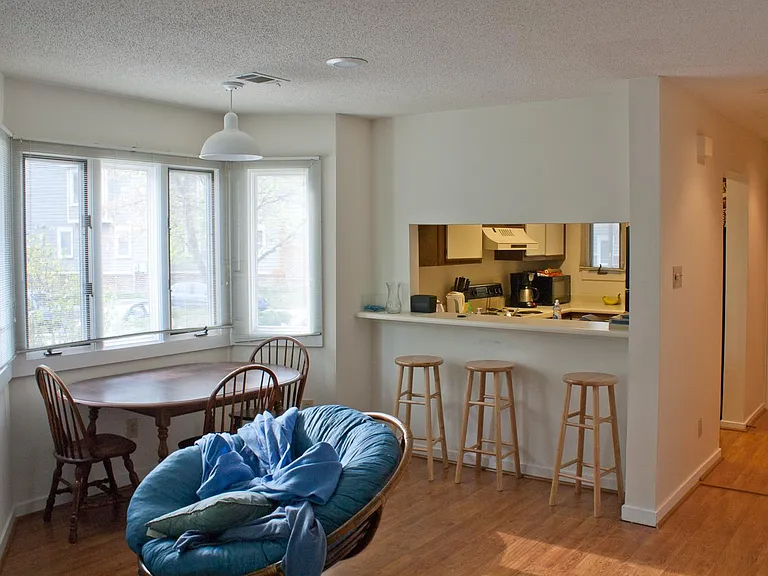 View of dining area with bay window. Very light filled home.