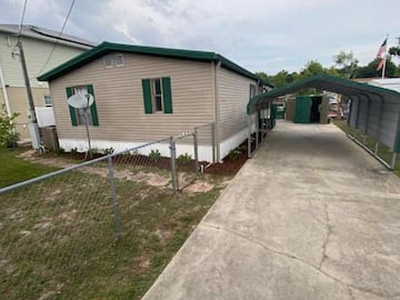 Lockable fence with multiple gates, surrounds the entire perimeter of the property. It extends across the driveway as well. Great for keeping pets and children safe.