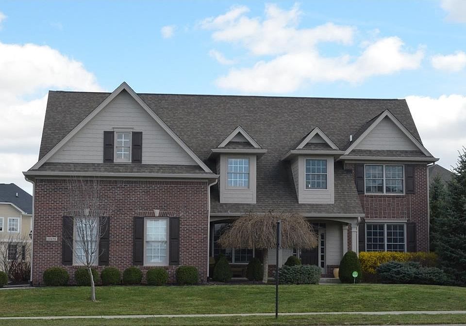 Classic exterior with tasteful brick and dormer windows is so attractive!