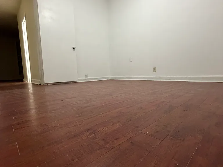 Bedroom 3. you can see 2nd bathroom down the hall.