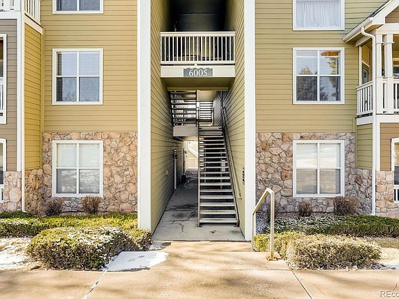 Stairs leading straight to front door of the unit on right hand.