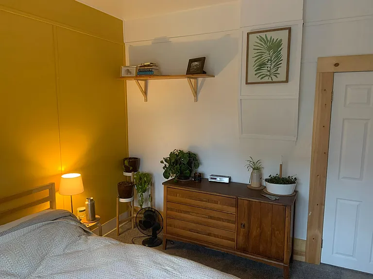 Main bedroom w/ closet facing street.