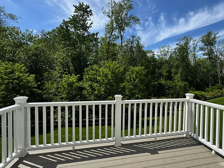 Seamless indoor-outdoor living! Private deck with peaceful, wooded views_perfect for morning coffee, grilling, or relaxing.