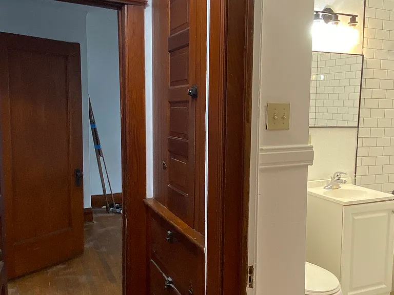 Custom built-ins for storage outside the bathroom.