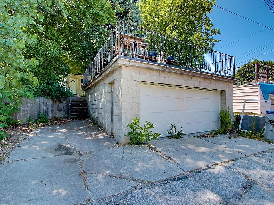 Garage is accessed from the alley. Slab is for the upper, two garage spots for the lower unit.