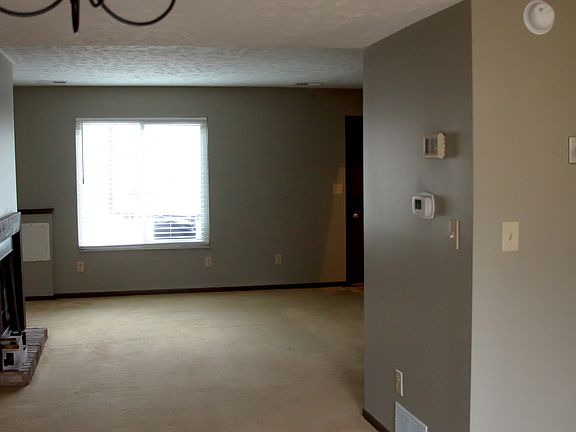 Kitchen and dining area looking back at living area.