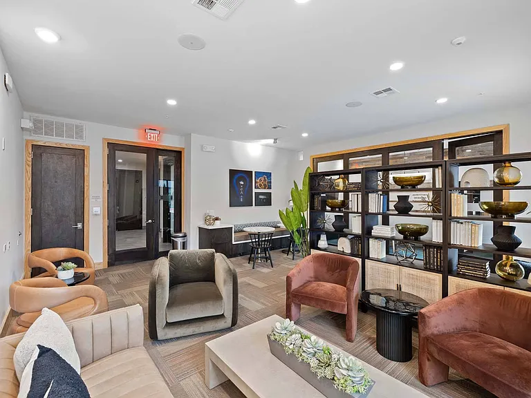 Stay inspired in a modern lounge filled with natural light, comfortable seating, and space to work or unwind.