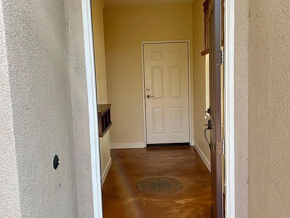 Entry way on ground level leads to upstairs. Door in rear is connected to 2 car garage