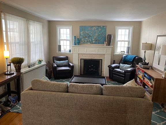 Front living room on the main level - lots of light. Fireplace is cosmetic only.