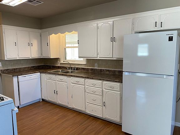 Brand new refrigerator, dishwasher, and gas stove. Newly painted cabinets.