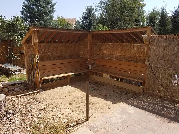 Tiki-style sand pit in back yard, great outdoor living space