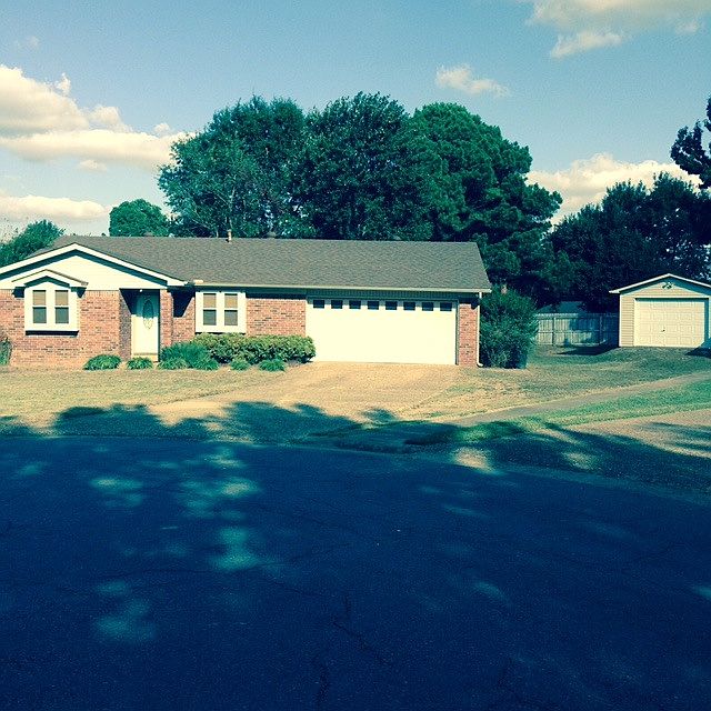 View of front of house and storage shop
