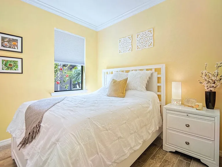 2nd bedroom with queen bed, new mattress, nightstand, TV and closet