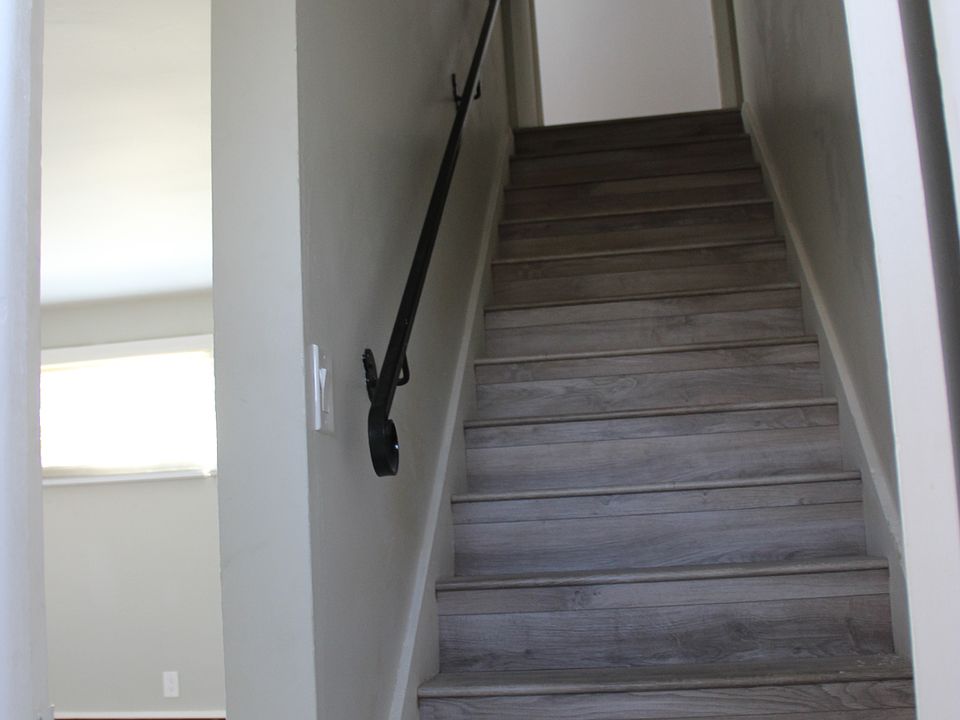 Stairwell to upstairs bed & bath.