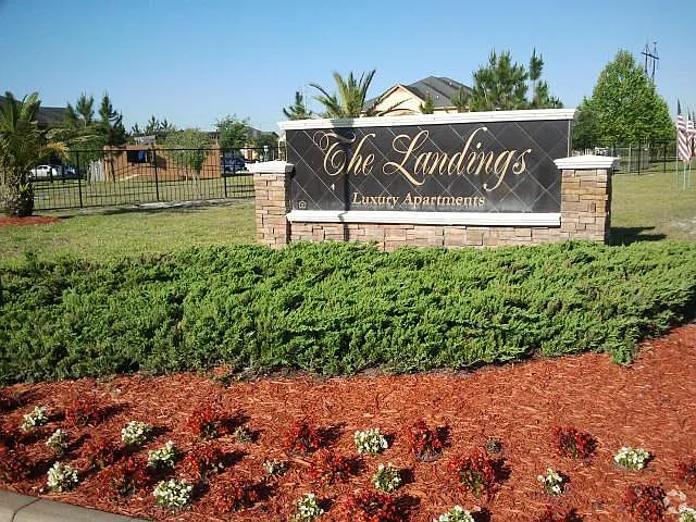 Beautifully maintained landscaping with lush greenery, manicured lawns, and vibrant seasonal plants. The outdoor space offers a peaceful, well-designed environment perfect for relaxing or entertaining.