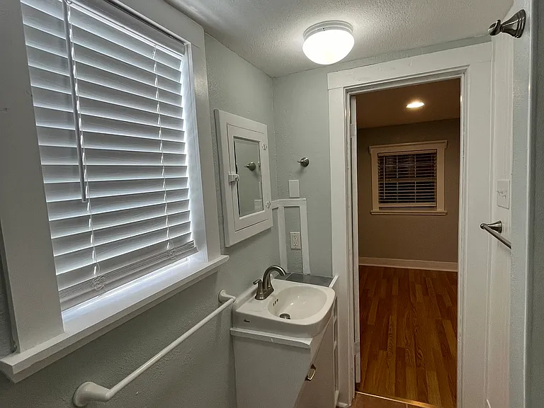 Bathroom facing out toward bed/living space