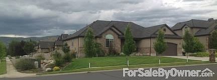 Tree lined front of home on corner lot