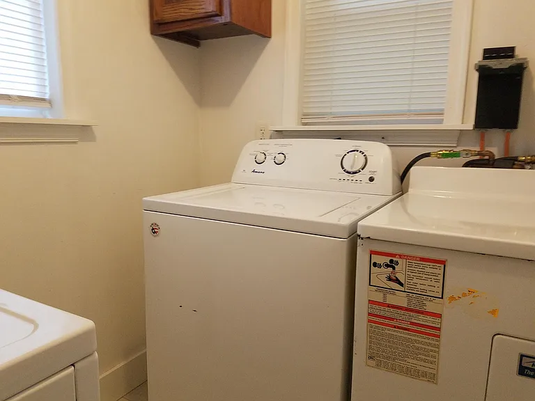 Laundry room (washer and water heater to right of washer).