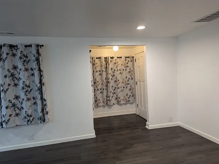 Open walk in the door nook with more windows.
