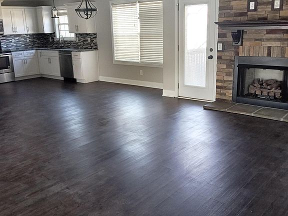 Living room, fire place + Kitchen