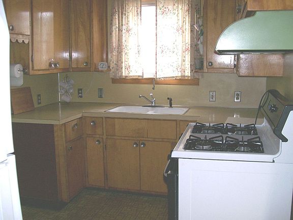 Kitchen - loaded w/ cabinets plus coatm Coset & Laundry Shute