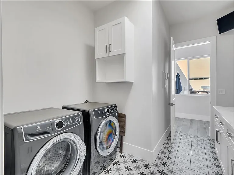 LARGE LAUNDRY ROOM WITH SPACE FOR 4 WASHER-DRYERS