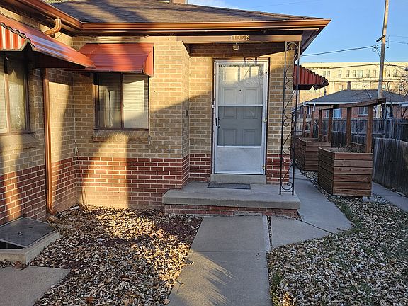 Front entry with planters on side of home