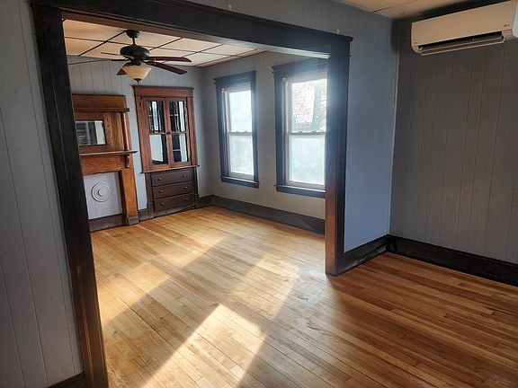Living room/formal dining (if you wanted a formal dining area.) Note the mini-split that provides both AC and heat.