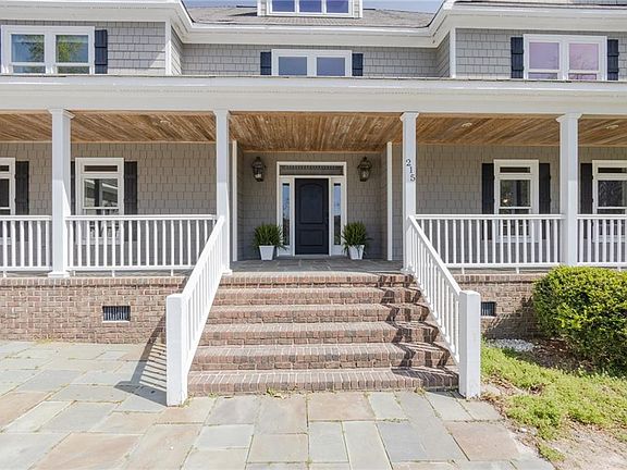 Enter onto a beautiful front porch.
