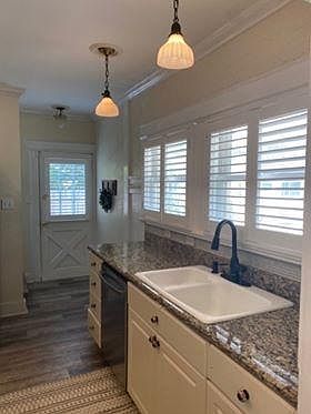 Kitchen leading to backdoor and parking space