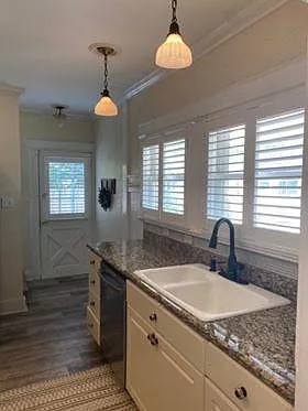 Kitchen leading to backdoor and parking space