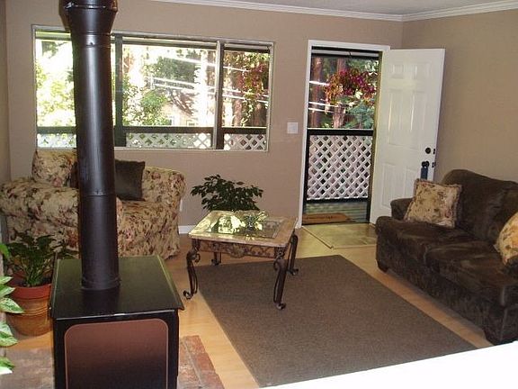 Living room w/wood burning fireplace