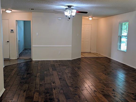 Large living area with real wood floors