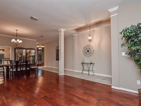 This beautiful entryway, with the custom columns, flows effortlessly into the formal dining room.