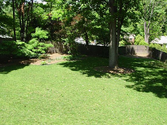 ALMOST 1/2 AC FENCED YARD!