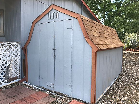 Storage shed off carport