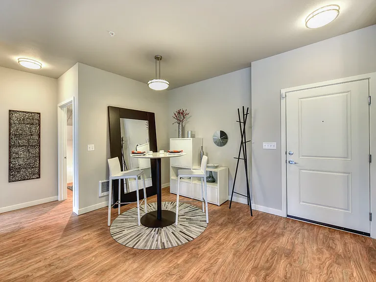 Dining Area and Entryway with Wood Inspired Floors