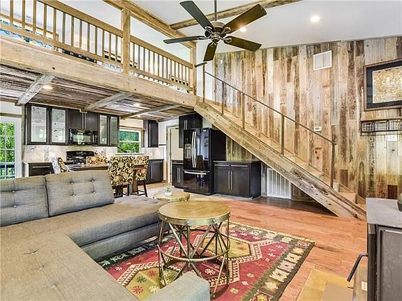 Open floor plan, custom staircase takes you to the loft and study/possible bedroom