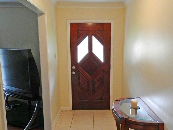 Front entry of the home, 18X18 tile and crown molding.